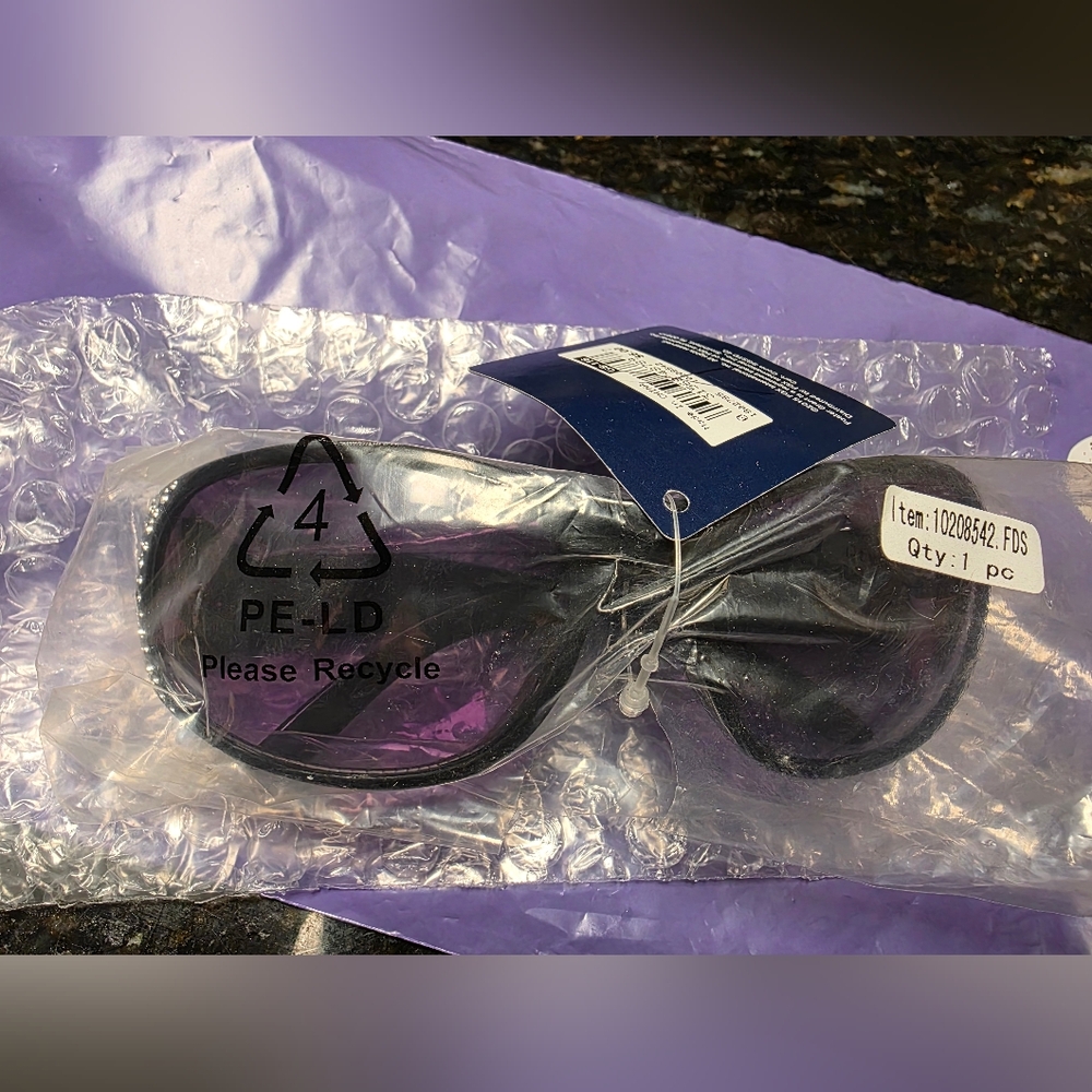 Stylish Black Sunglasses With Shiny Accents On Both Sides